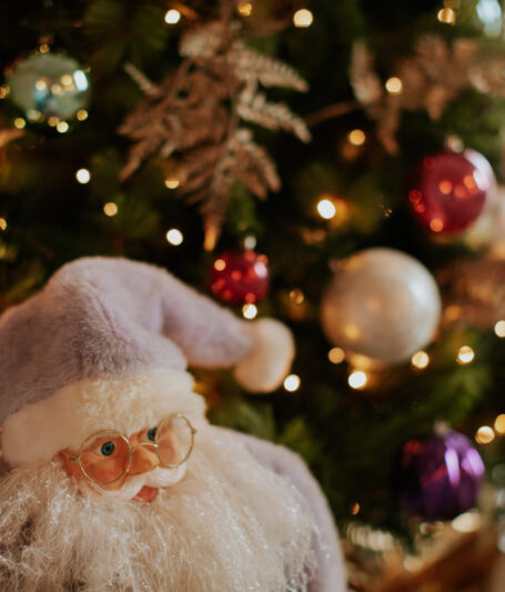 Christmas tree with sparkling lights and Santa ornament